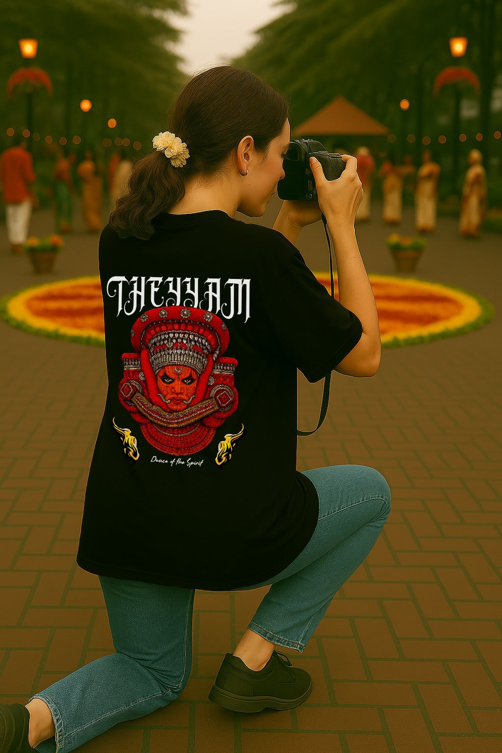 Person wearing a black t-shirt with a red and white design, taking a photo outdoors.