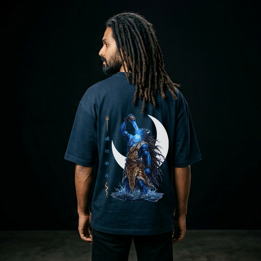 Person wearing a dark blue t-shirt with a graphic design on the back against a black background